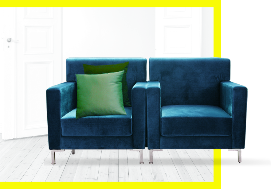 A set of two blue couches with a green cushion on one of them